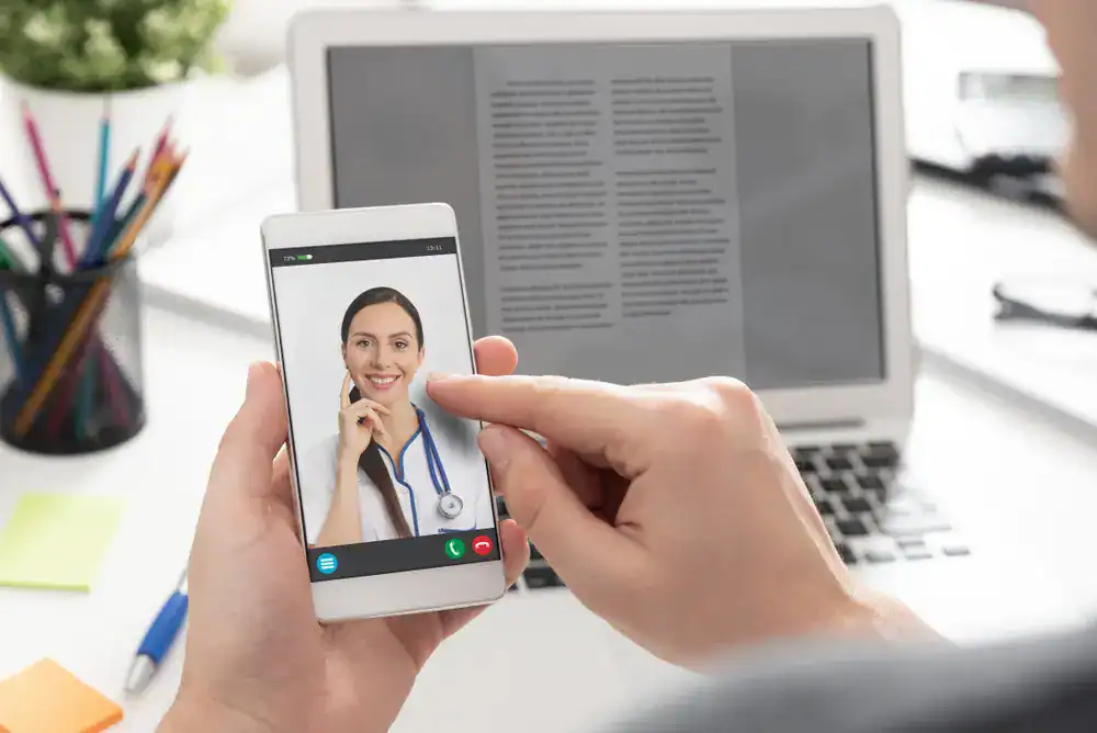Weight Loss Treatment_Fort Lauderdale (3) Telemedicine consultation with a healthcare professional via smartphone.