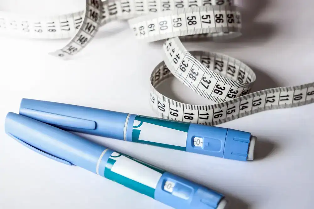 Weight Loss Treatment_Sarasota (1) Blood glucose meters and measuring tape for weight management and health monitoring.